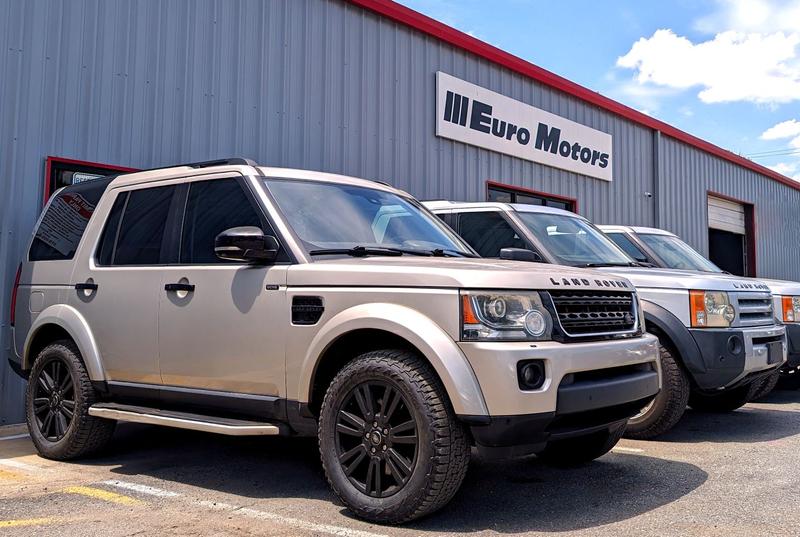 Front of Euro Motors building with Land Rover LR4 and LR3